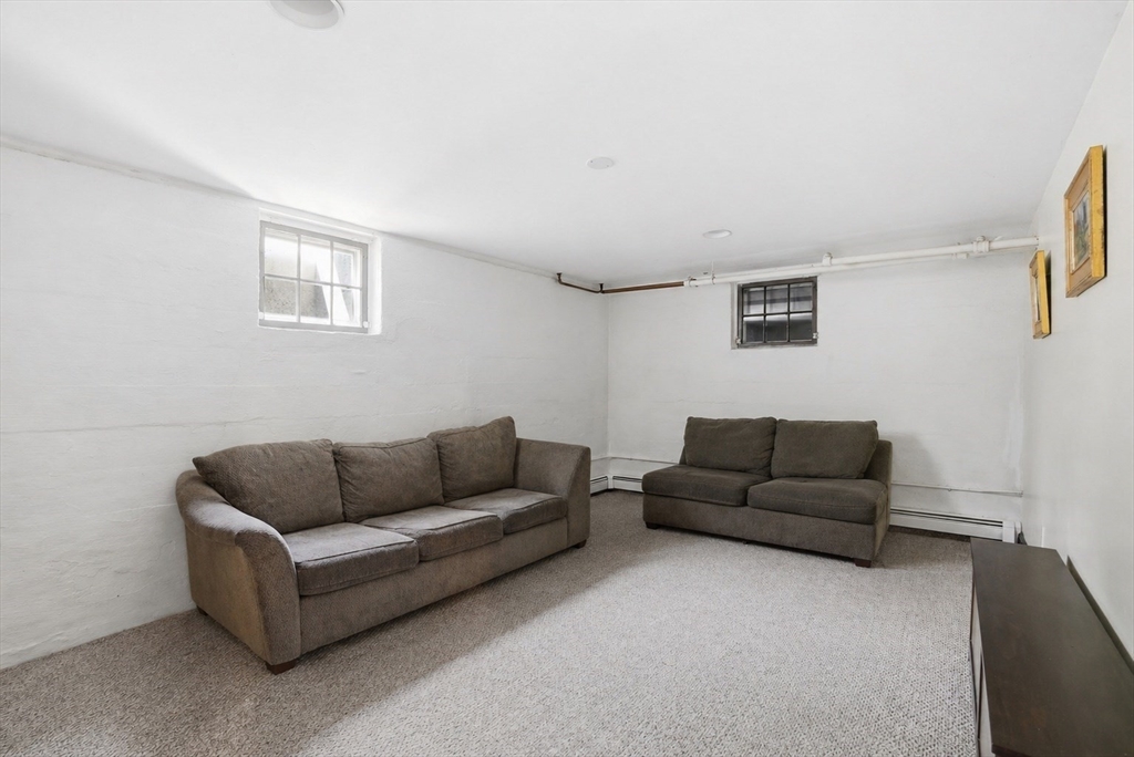 34 Governor Long Road Hingham, MA 02043 - Photo 25 of 37 a living room with furniture and a couch