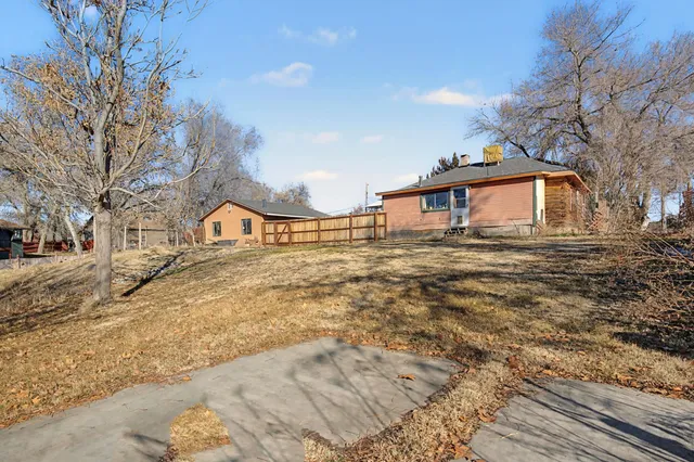 a view of a house with a snow on the road
