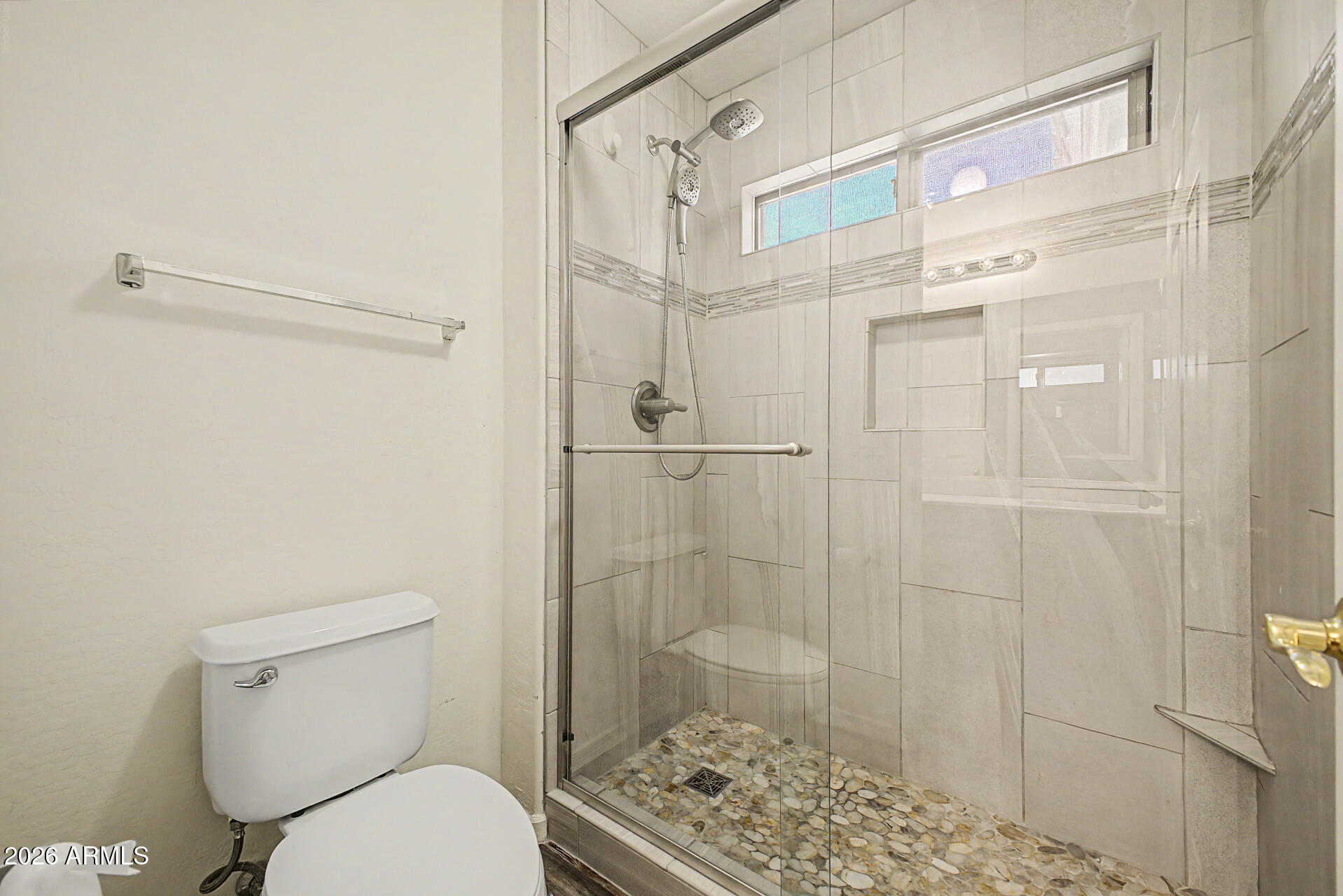 6622 West Harwell Road Laveen, AZ 85339 - Photo 25 of 32 a bathroom with a toilet and a shower
