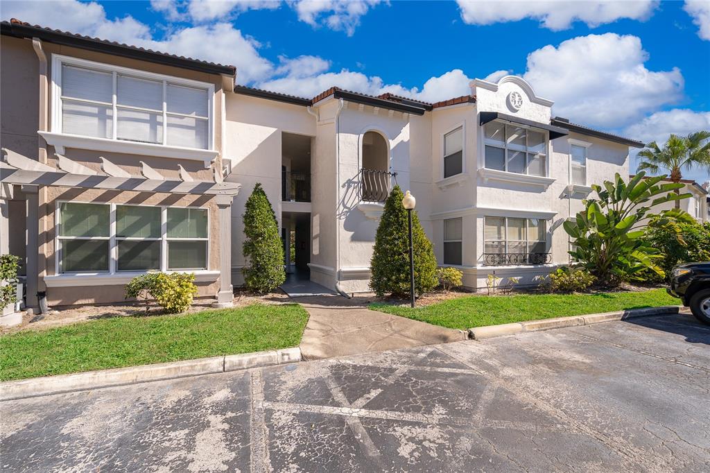 a front view of a house with garden and porch