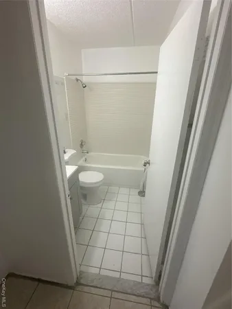 a bathroom with a sink a toilet and a shower