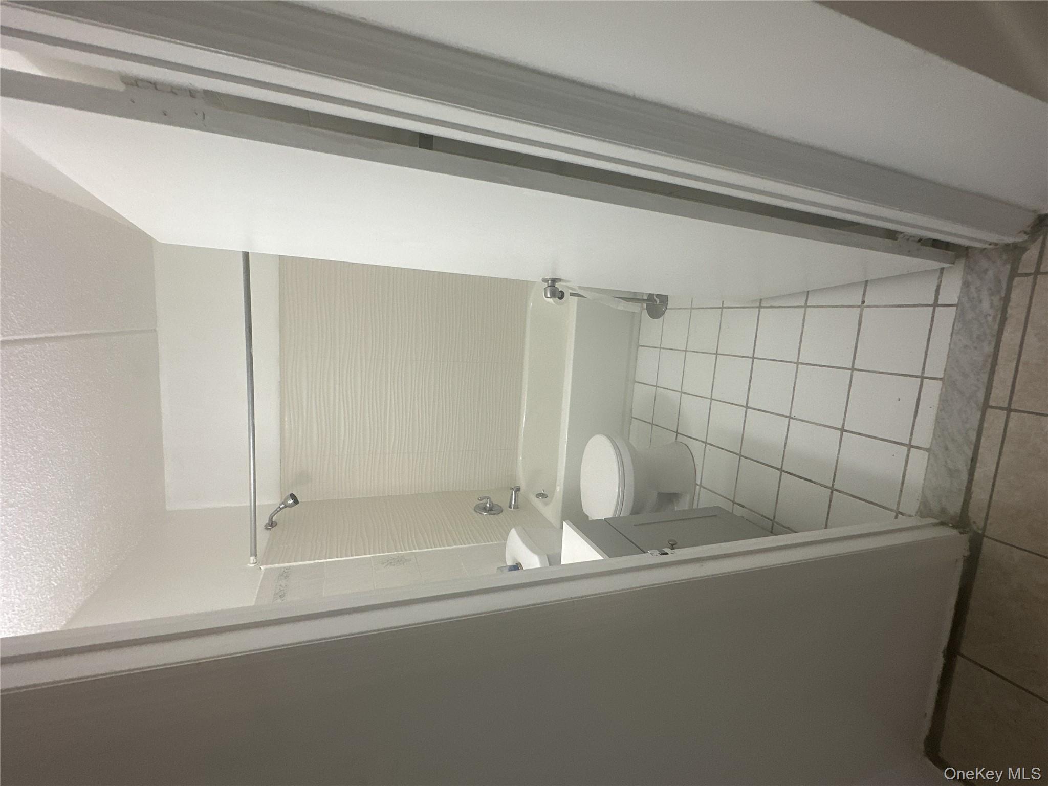 43 Menahan Street, Unit 2 Brooklyn, NY 11221 - Photo 4 of 5 a bathroom with a sink a toilet and a shower