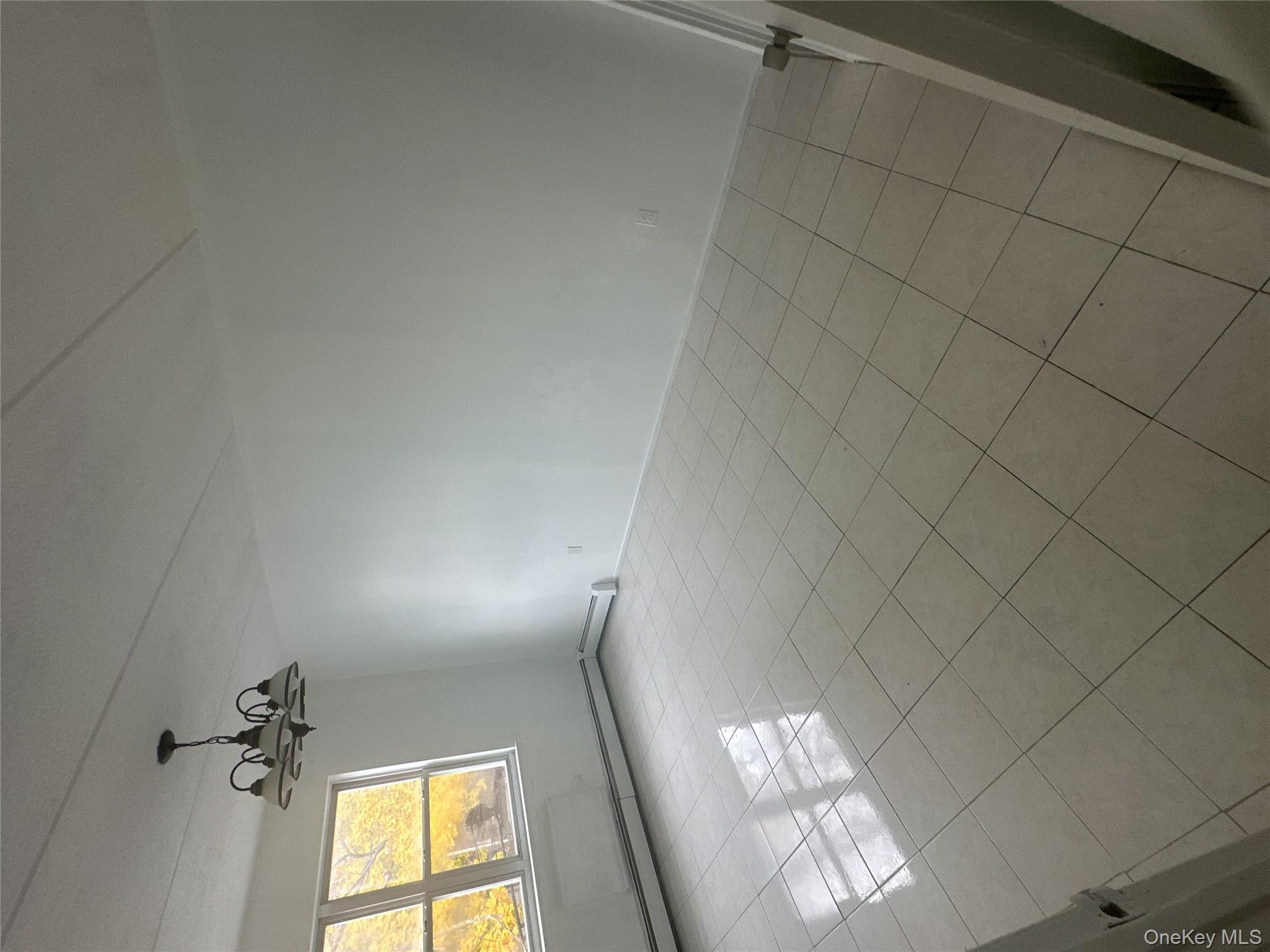 43 Menahan Street, Unit 2 Brooklyn, NY 11221 - Photo 5 of 5 a view of an empty room and a window