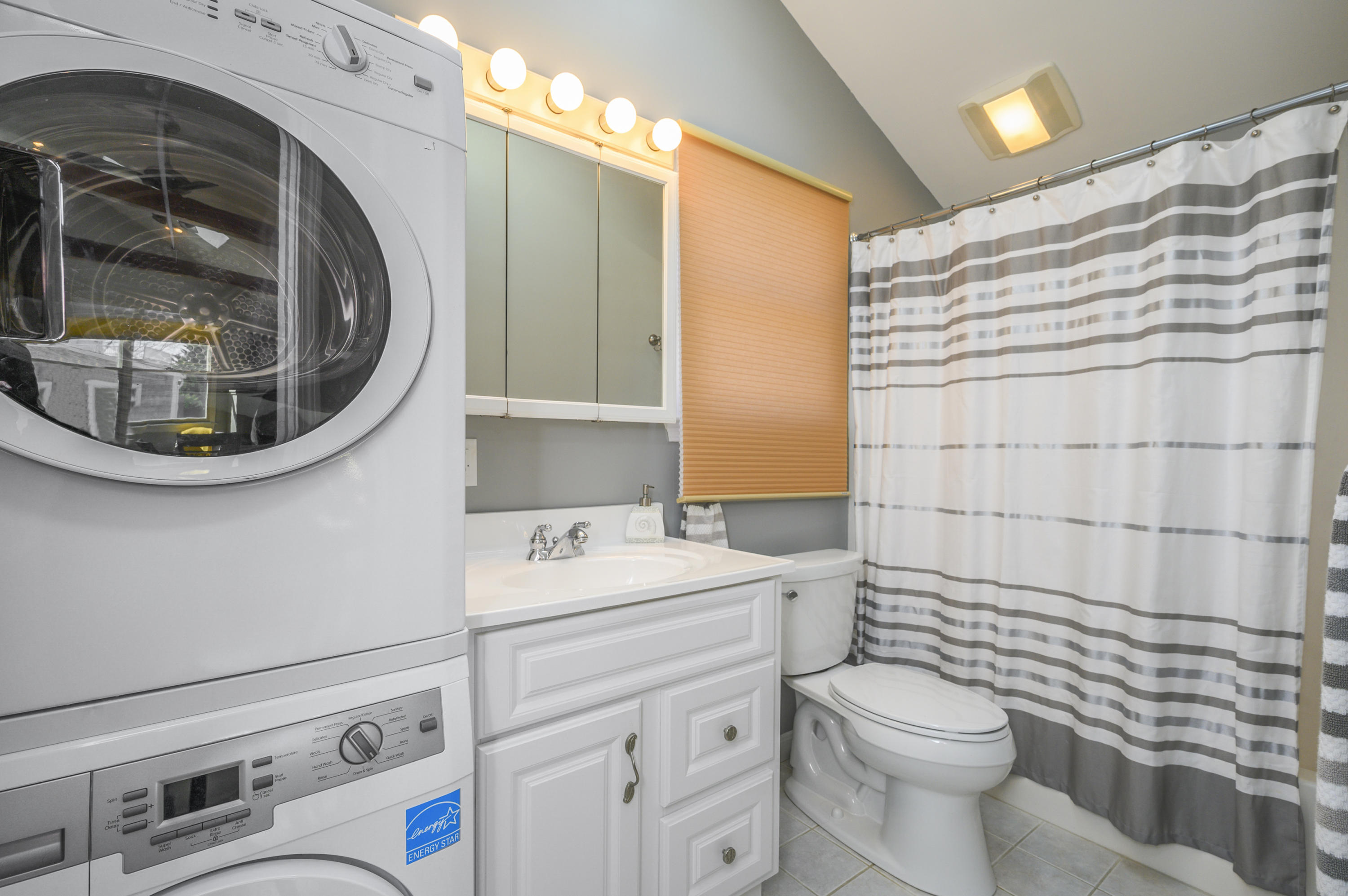 27 Locust Road, Unit 2 Eastham, MA 02642 - Photo 16 of 26 a bathroom with a toilet sink and mirror