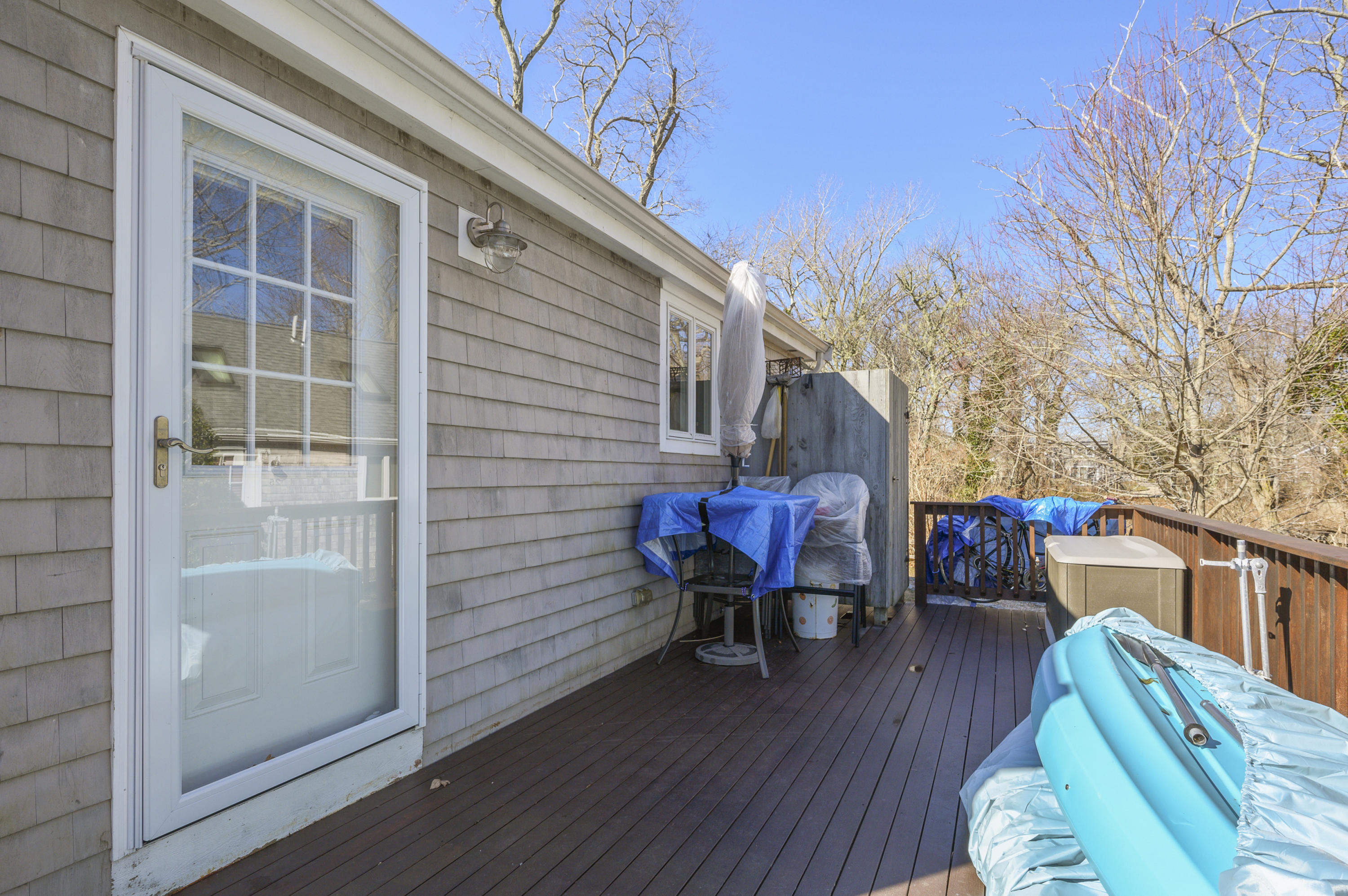 27 Locust Road, Unit 2 Eastham, MA 02642 - Photo 17 of 26 a view of two chairs in patio of the house