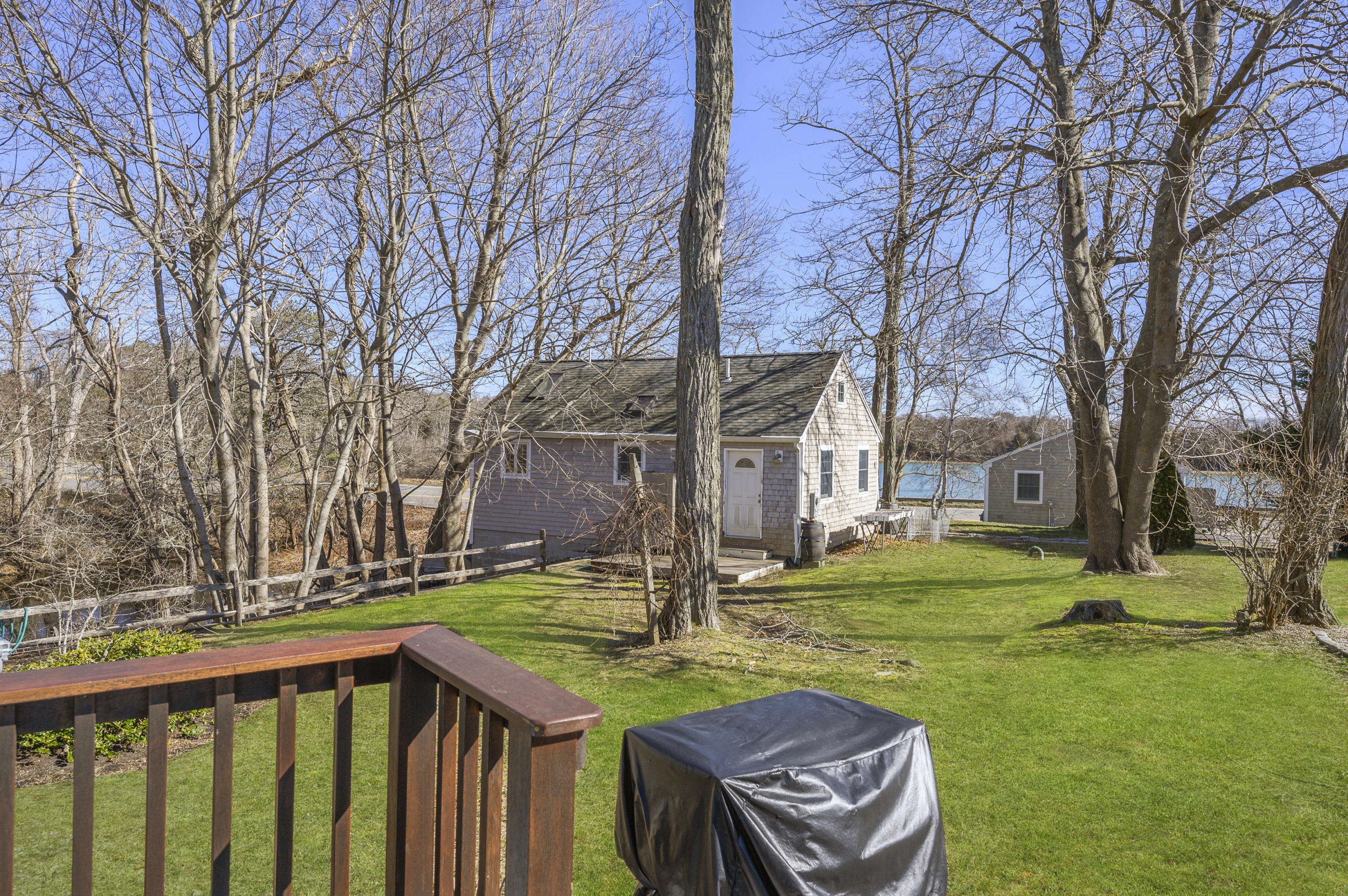 27 Locust Road, Unit 2 Eastham, MA 02642 - Photo 18 of 26 a view of a patio with a yard