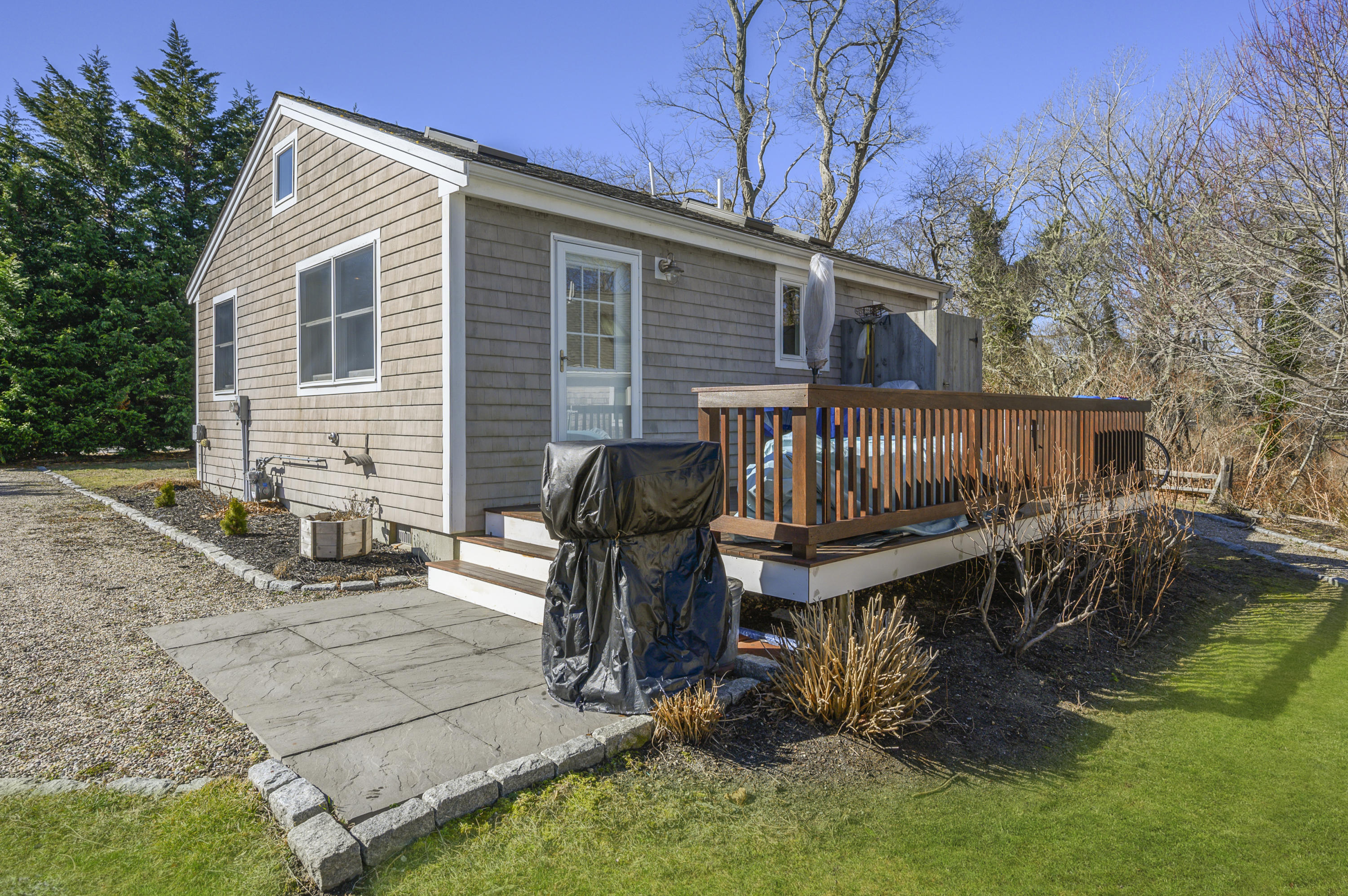 27 Locust Road, Unit 2 Eastham, MA 02642 - Photo 19 of 26 a view of a house with backyard and sitting area