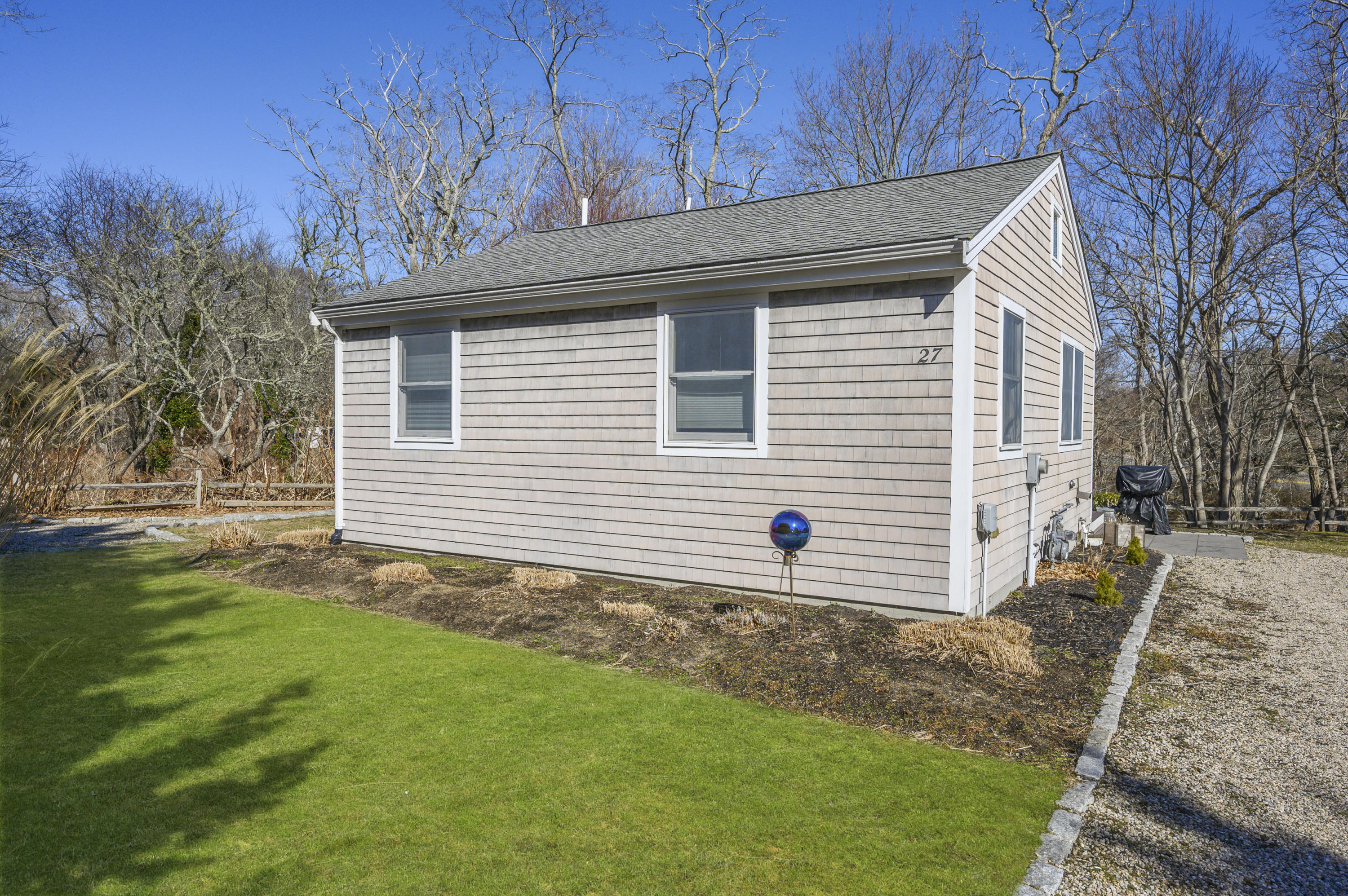 27 Locust Road, Unit 2 Eastham, MA 02642 - Photo 20 of 26 a front view of a house with garden