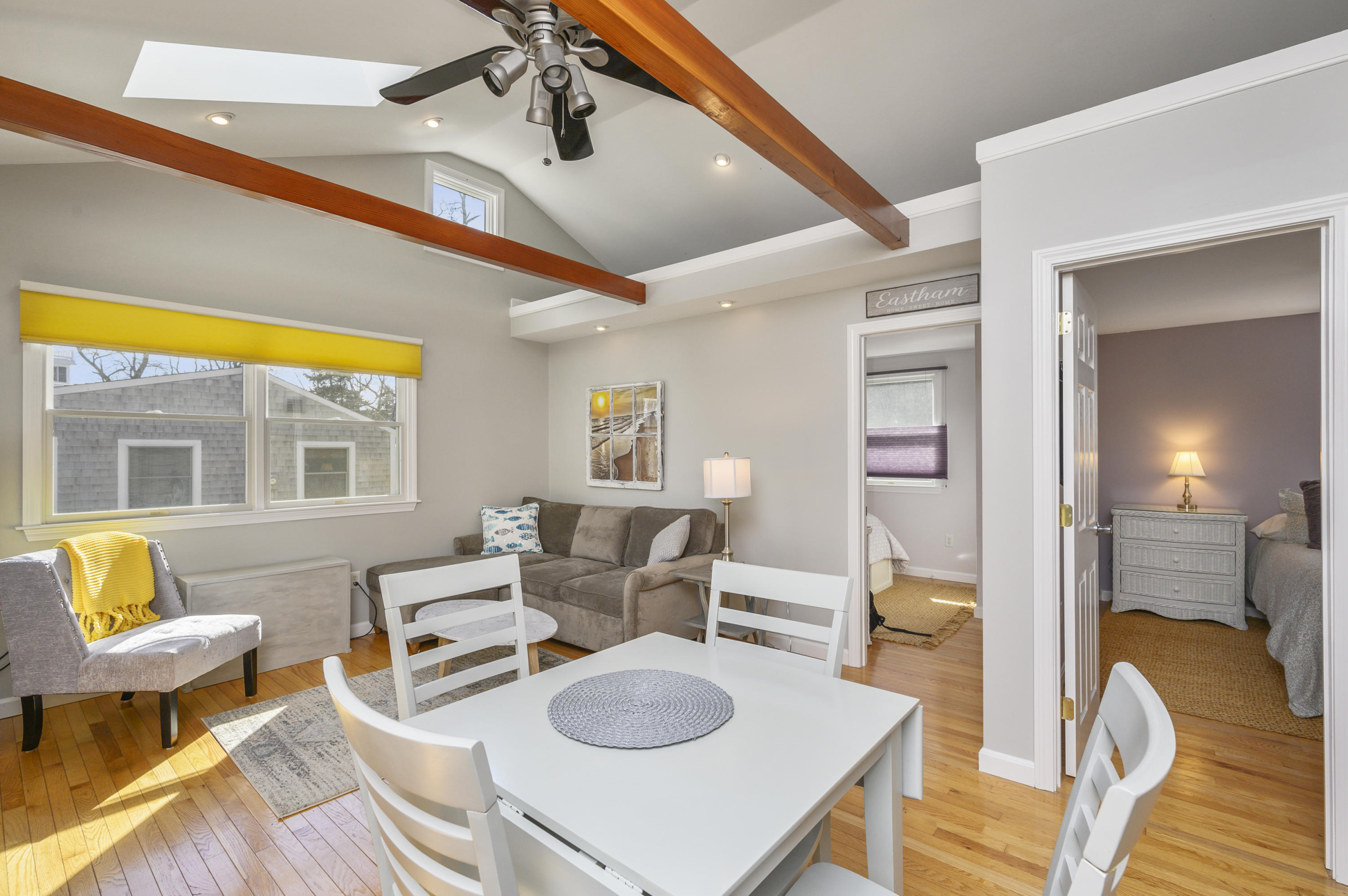 27 Locust Road, Unit 2 Eastham, MA 02642 - Photo 8 of 26 a living room with furniture and a table