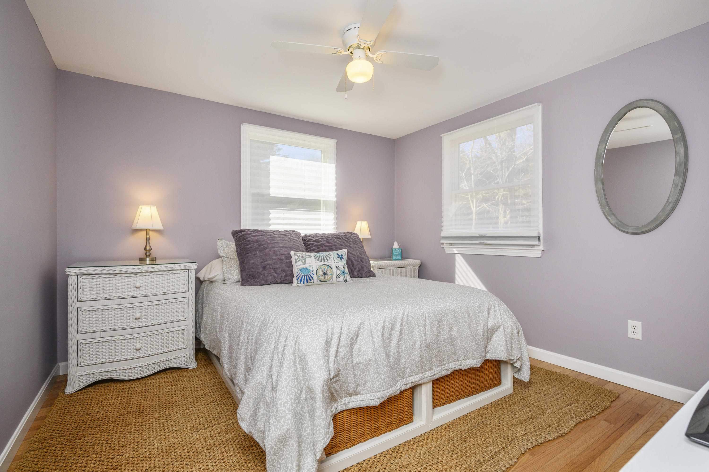 27 Locust Road, Unit 2 Eastham, MA 02642 - Photo 9 of 26 a bedroom with a bed chandelier and a window