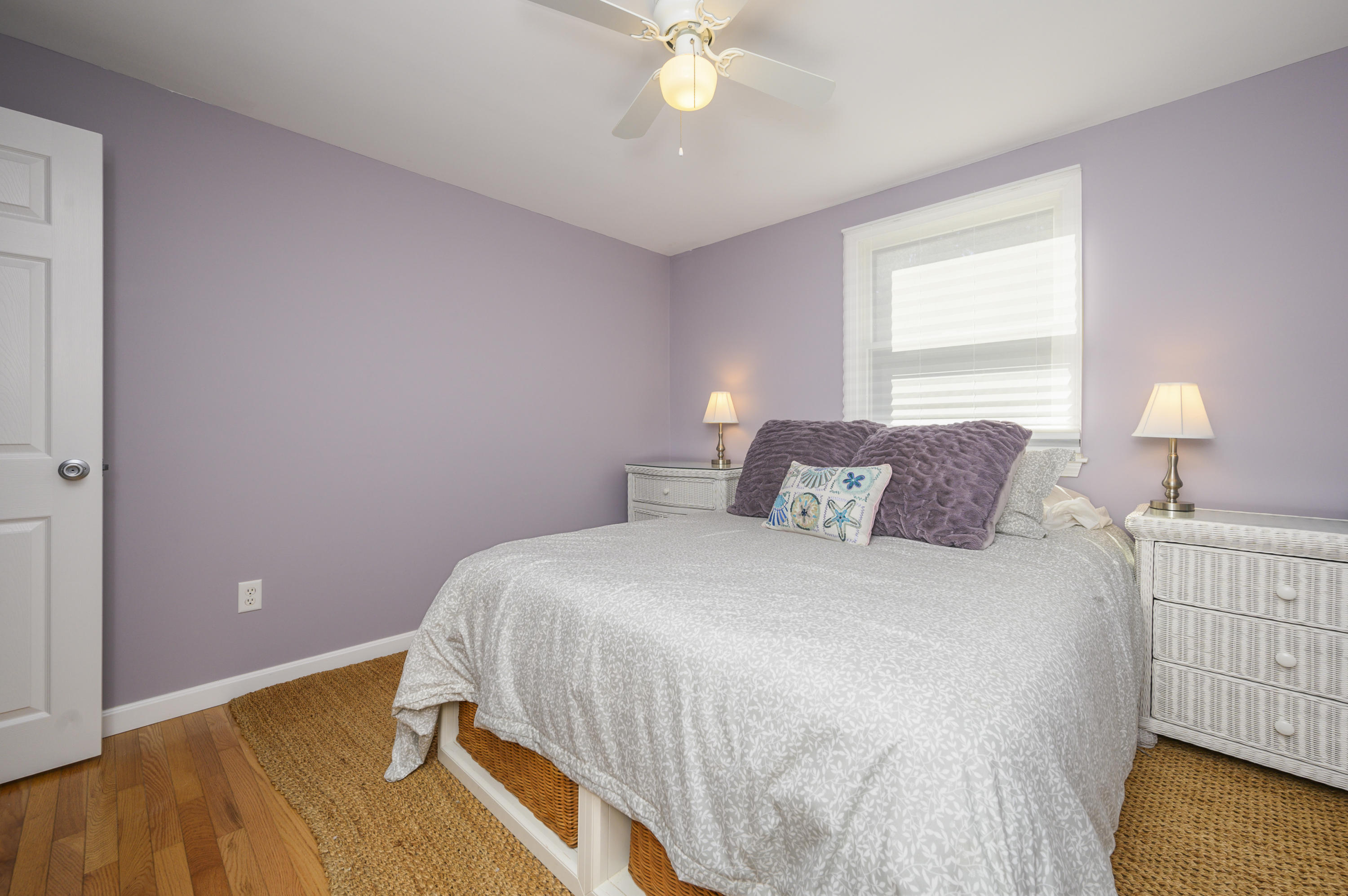 27 Locust Road, Unit 2 Eastham, MA 02642 - Photo 10 of 26 a bedroom with a bed and a window