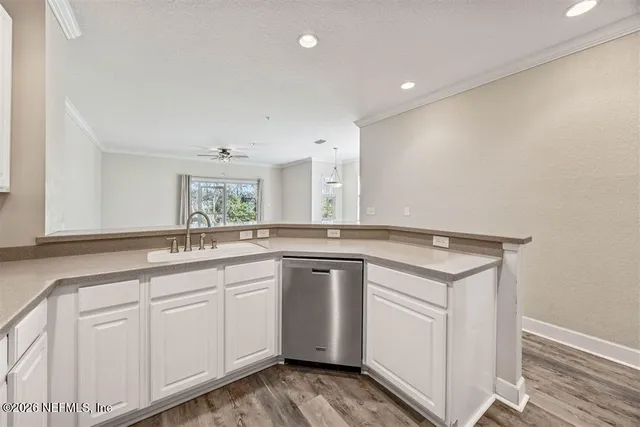a bathroom with a shower and a sink
