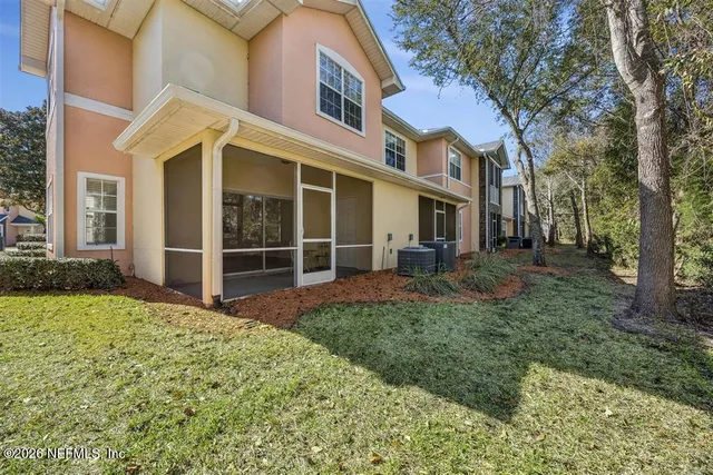 a view of a yard with a tree