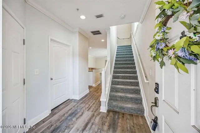 a view of entryway with wooden floor
