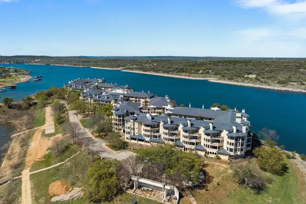 an aerial view of a house with a ocean view