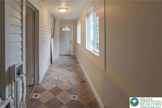 a view of a hallway with windows