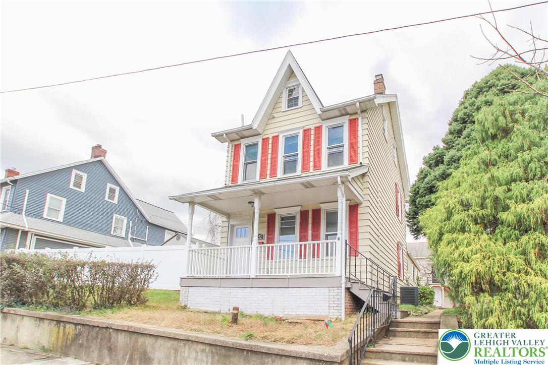 1522 Center Street, Unit 1 Bethlehem, PA 18018 - Photo 2 of 19 a front view of a house with a garden and balcony