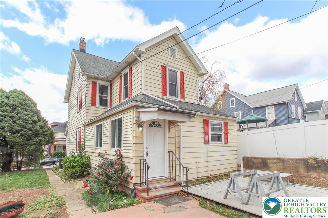 1522 Center Street, Unit 1 Bethlehem, PA 18018 - Photo 4 of 19 a view of a white house with a large windows