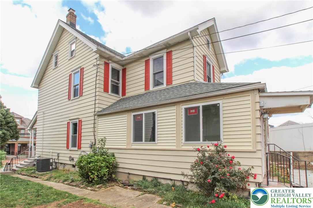 1522 Center Street, Unit 1 Bethlehem, PA 18018 - Photo 5 of 19 a front view of a house with a yard
