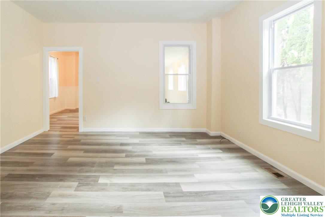 1522 Center Street, Unit 1 Bethlehem, PA 18018 - Photo 9 of 19 a view of empty room with window and wooden floor