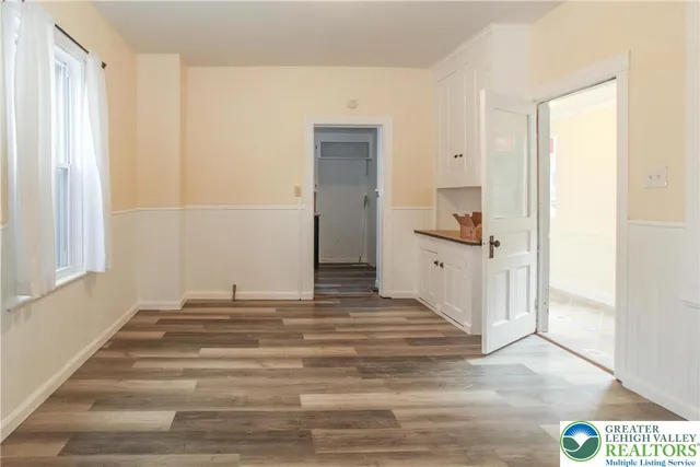 a view of a bathroom with a sink and a mirror