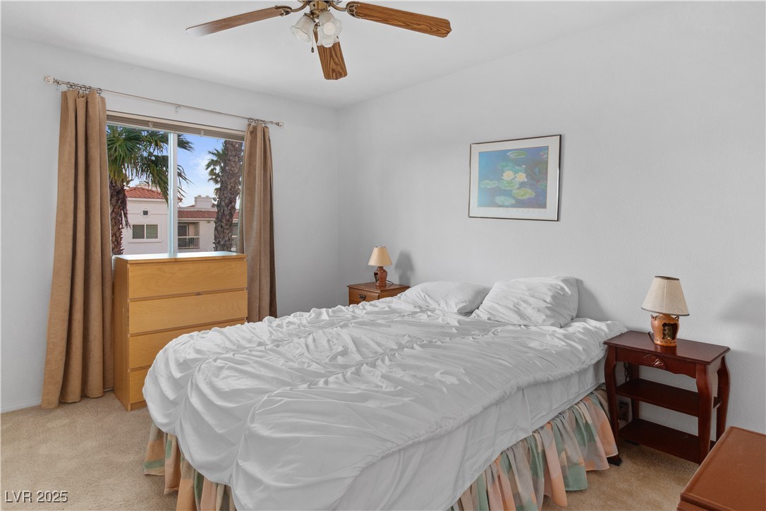 1928 Las Palmas Lane, Unit 228 Laughlin, NV 89029 - Photo 23 of 77 Third Bedroom featuring light colored carpet and ceiling fan