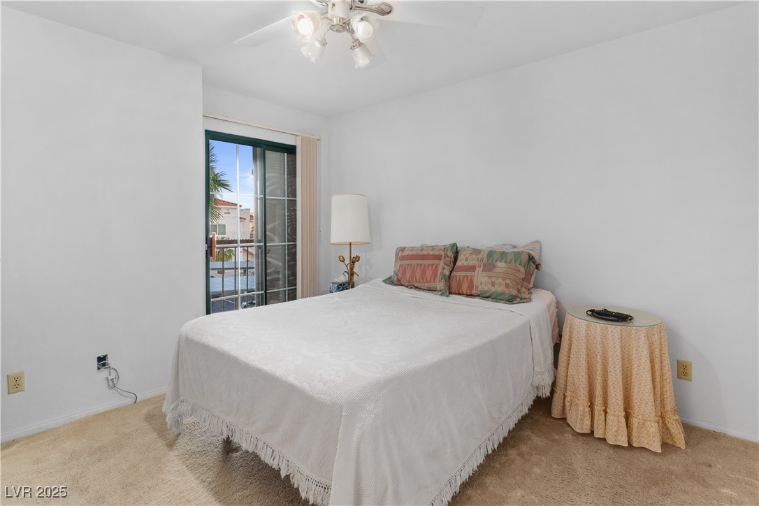 1928 Las Palmas Lane, Unit 228 Laughlin, NV 89029 - Photo 27 of 77 Carpeted Primary bedroom featuring baseboards and ceiling fan
