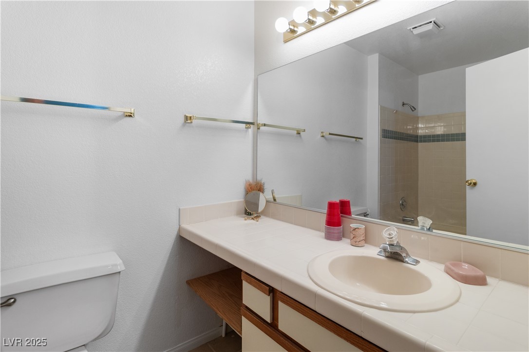1928 Las Palmas Lane, Unit 228 Laughlin, NV 89029 - Photo 29 of 77 Ensuite Primary Bathroom with toilet and vanity
