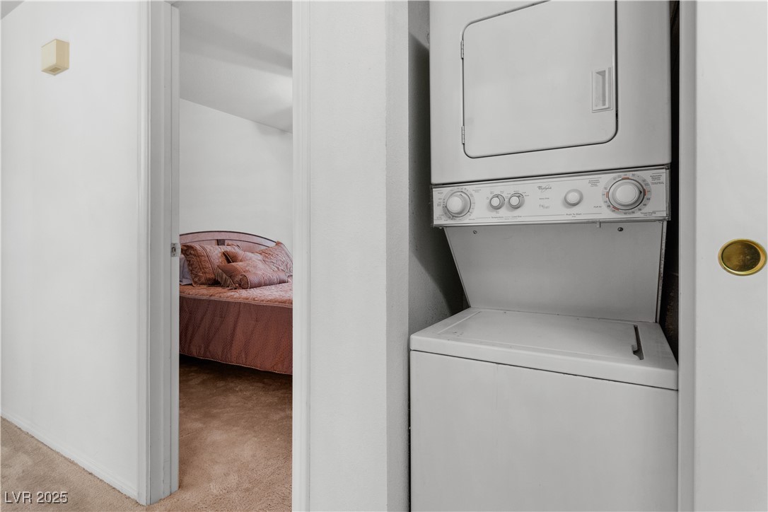 1928 Las Palmas Lane, Unit 228 Laughlin, NV 89029 - Photo 38 of 77 Laundry closet, located in the hallway featuring stacked washer / drying machine