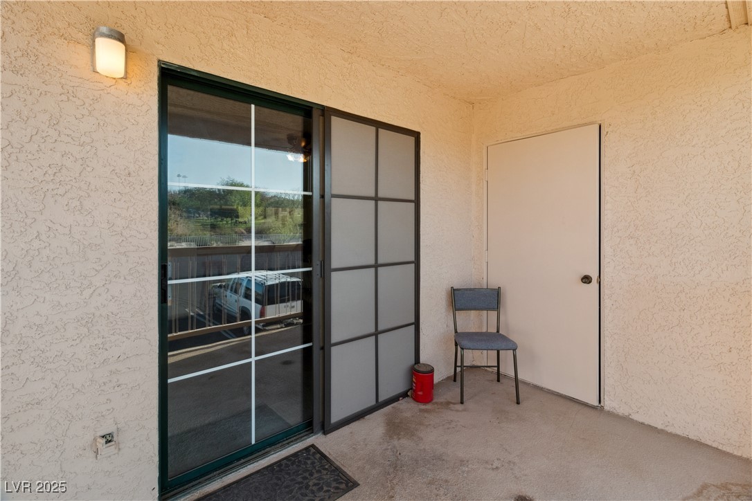 1928 Las Palmas Lane, Unit 228 Laughlin, NV 89029 - Photo 39 of 77 Doorway to property featuring stucco siding