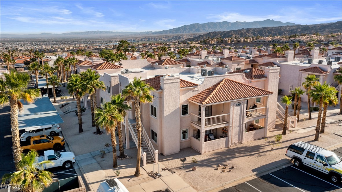 1928 Las Palmas Lane, Unit 228 Laughlin, NV 89029 - Photo 63 of 77 Aerial perspective of suburban area with a mountainous background