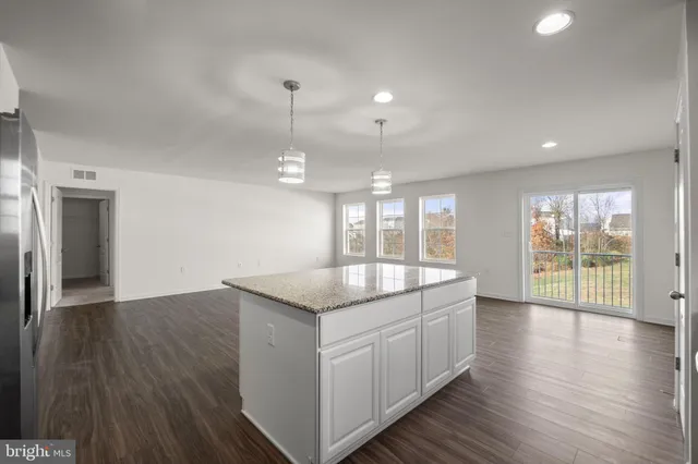 a kitchen with a sink and large window