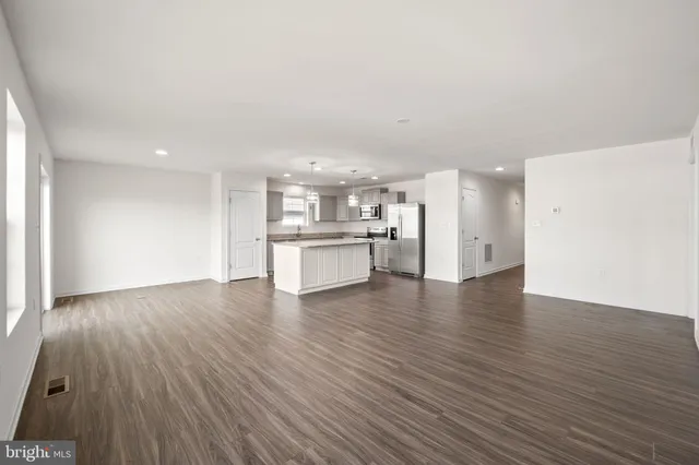 a view of a kitchen with a sink and a stove top oven