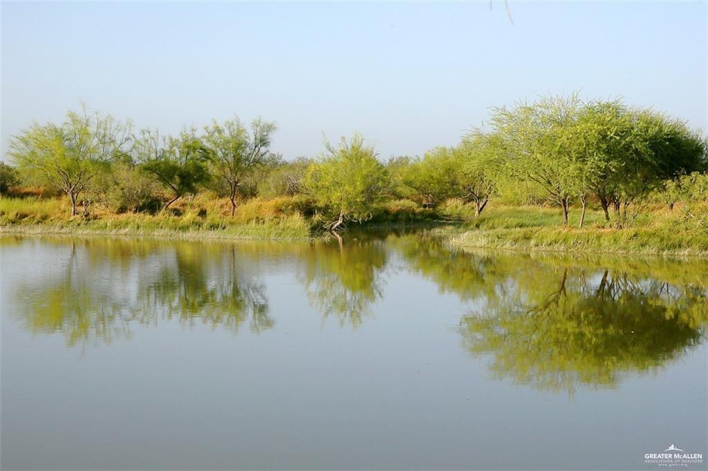 0 Loma Blanca Road Roma, TX 78584 - Photo 23 of 34 a view of a lake with a building in the background