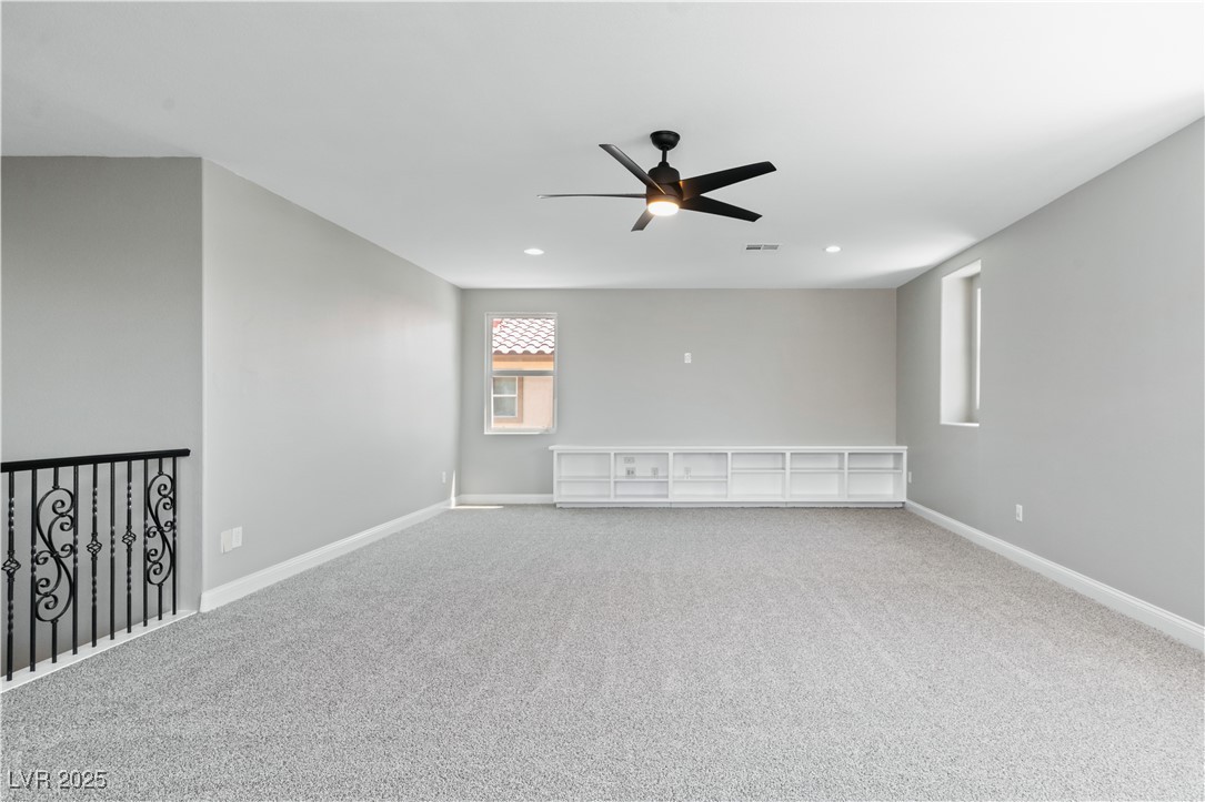 312 Pocono Ranch Avenue North Las Vegas, NV 89031 - Photo 23 of 34 Carpeted empty room featuring baseboards, recessed lighting, visible vents, and a ceiling fan