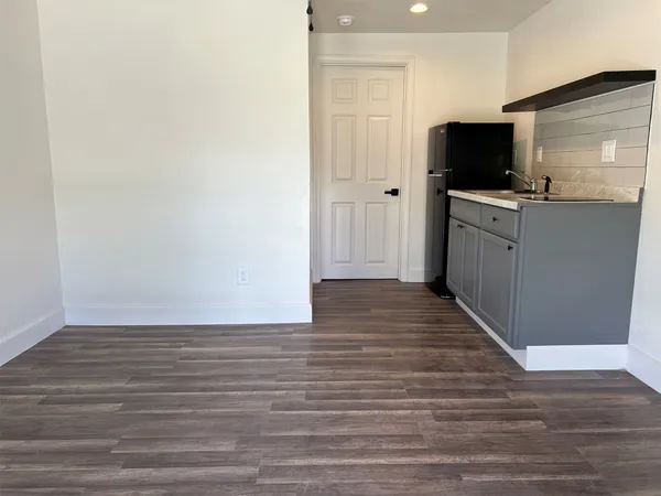 a view of a kitchen from the hallway
