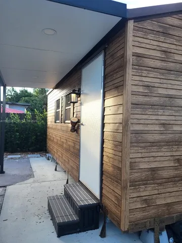 a view of sitting area in front of house