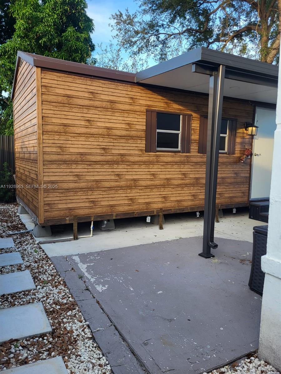 2137 Northwest 97th Street, Unit 2137 Miami, FL 33147 - Photo 3 of 19 a view of outdoor space and barbecue grill