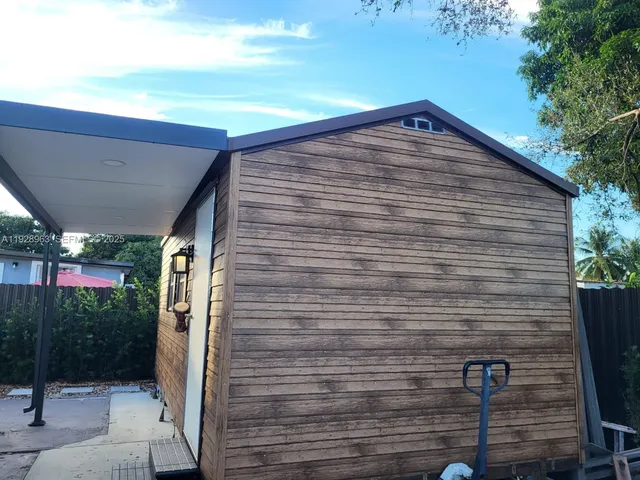 a view of porch with a bench