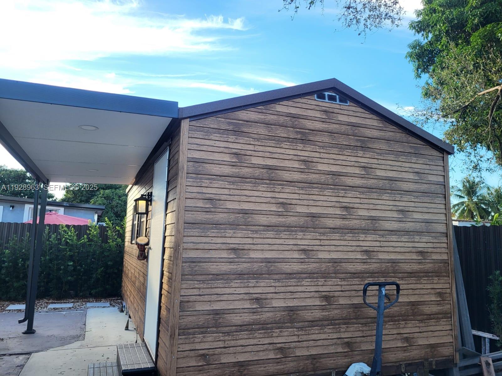 2137 Northwest 97th Street, Unit 2137 Miami, FL 33147 - Photo 5 of 19 a view of a backyard