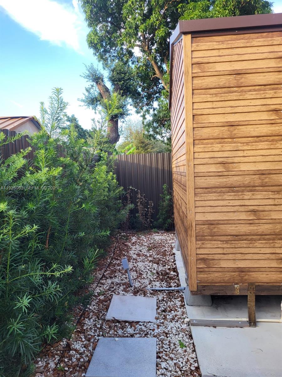 2137 Northwest 97th Street, Unit 2137 Miami, FL 33147 - Photo 7 of 19 a view of a backyard