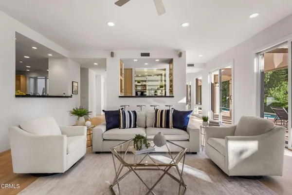 a kitchen with stainless steel appliances kitchen island granite countertop a sink and cabinets