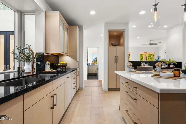 a kitchen with stainless steel appliances a sink and cabinets