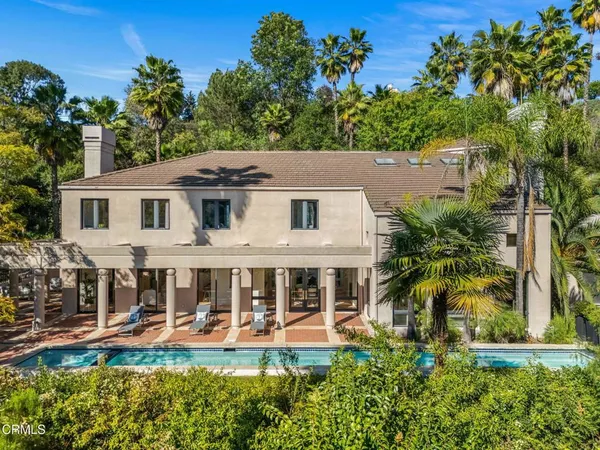 a view of a pathway of a building with a porch