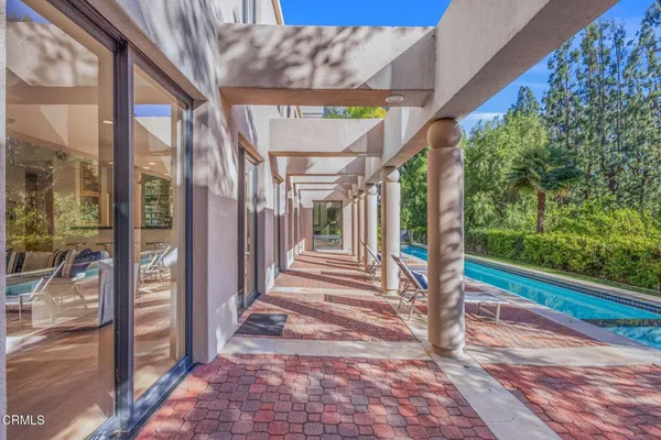 a spacious bedroom with a bed and a couch