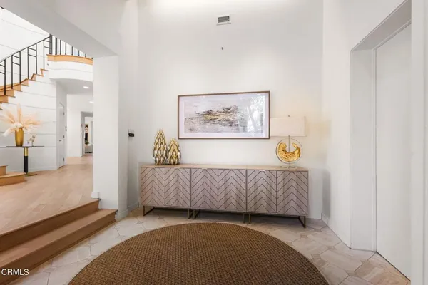 a view of a kitchen with dining room and wooden floor