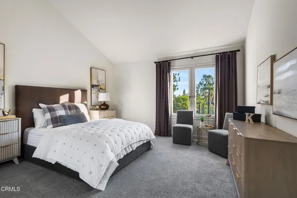 a view of balcony with floor to ceiling windows and tree