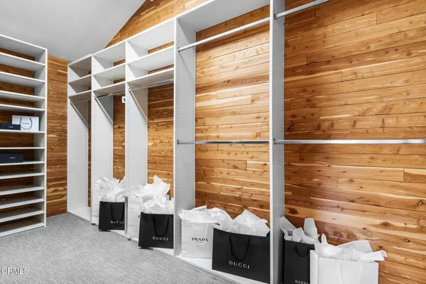 a view of backyard of house with outdoor seating