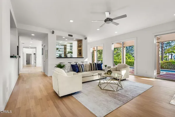 a living room with furniture and a large window