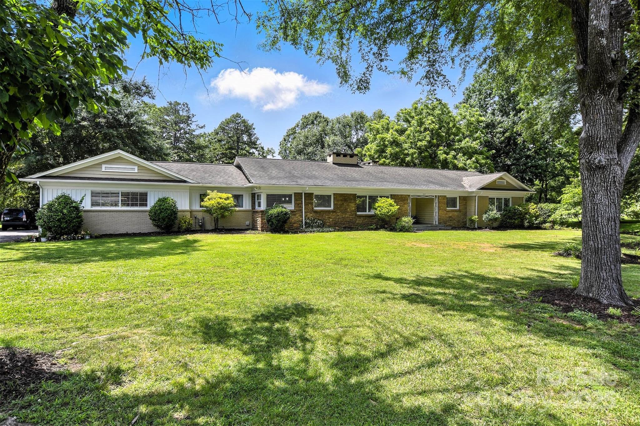 3127 North Center Street Hickory, NC 28601 - Photo 1 of 47 a front view of a house with a yard